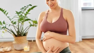 happy-pregnant-woman-doing-yoga-home_380164-265122-8198799