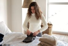 medium-shot-woman-folding-clothes_23-2149190360-1716564