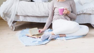 woman-reading-book-holding-cup-coffee_23-2147872011-8319674