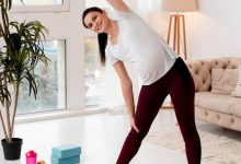 young-pregnant-woman-exercising-fitness-mat_23-2148752149-3711232