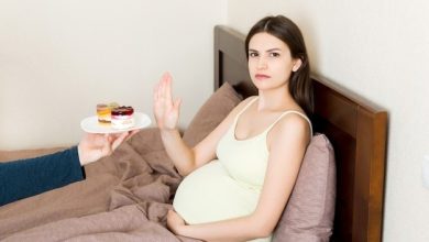 young-pregnant-woman-lying-bed-refusing-sweets_79075-9192-1767568